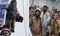 करंट से झुलसा मजदूर एक घंटे खंभे से लटका रहा, वीडियो बनाती रही पुलिस, स्कूल के गार्ड ने बचाई जान करंट से झुलसा मजदूर एक घंटे खंभे से लटका रहा, वीडियो बनाती रही पुलिस, स्कूल के गार्ड ने बचाई जान